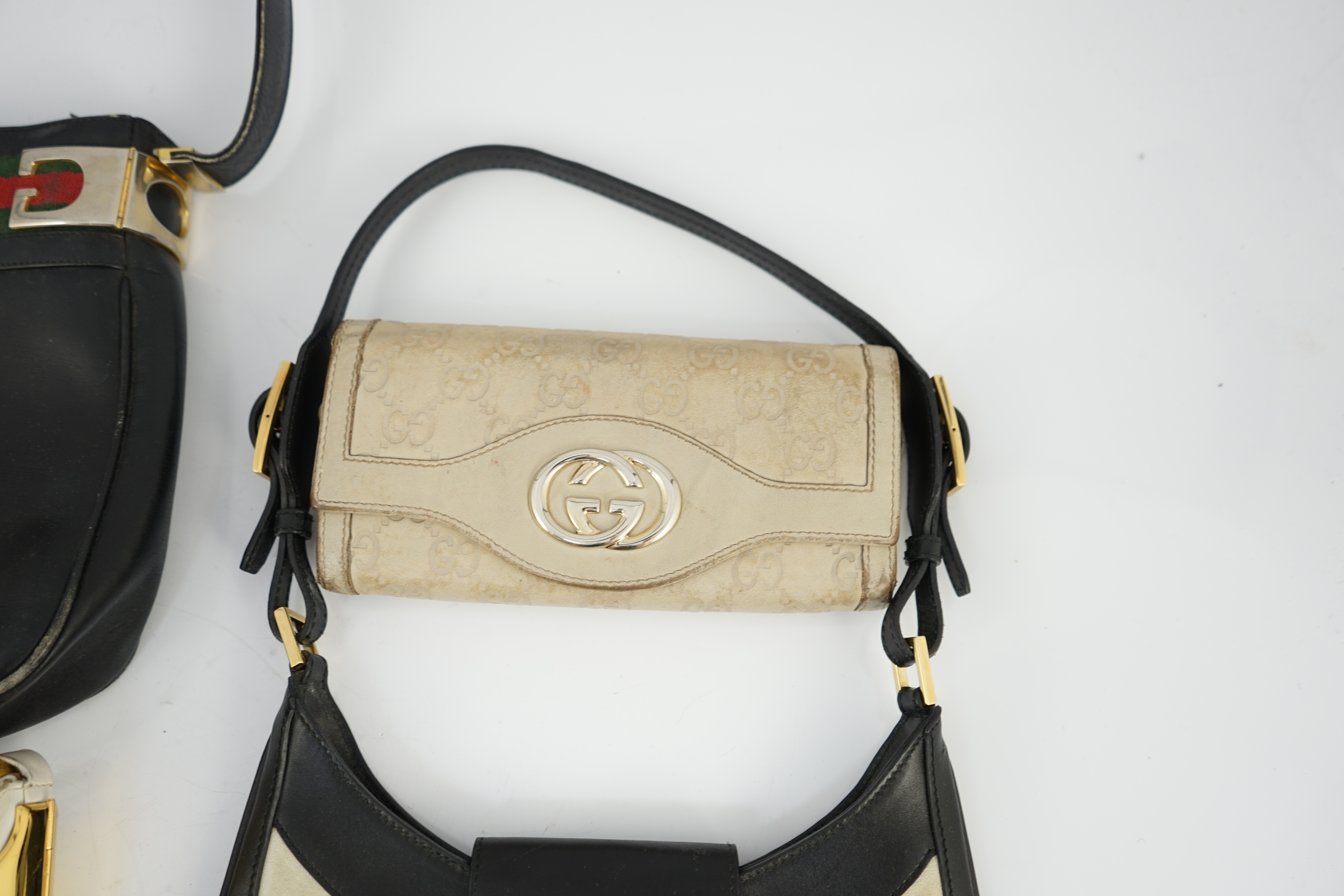 Three vintage Gucci hand bags and clutch wallet